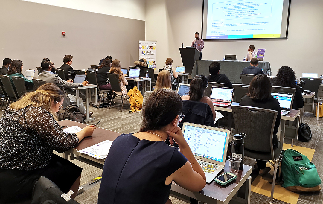 Students take notes during a workshop.