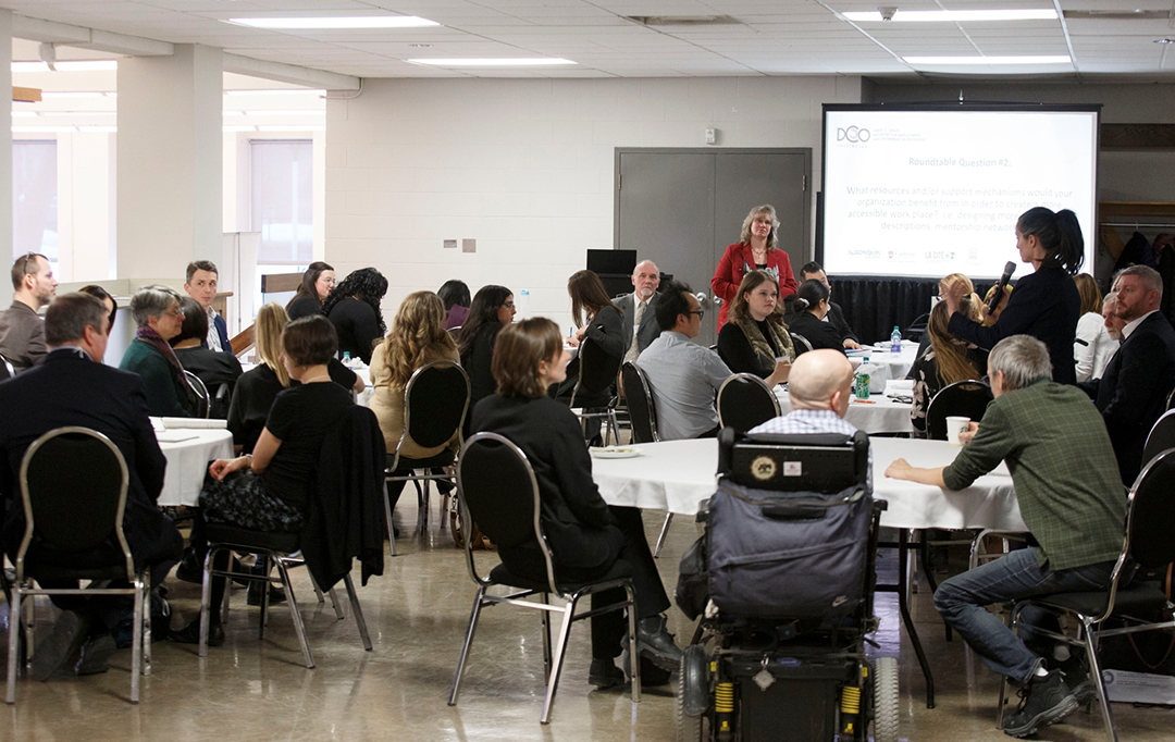 A group of employers and HR representatives engage in forum discussions.